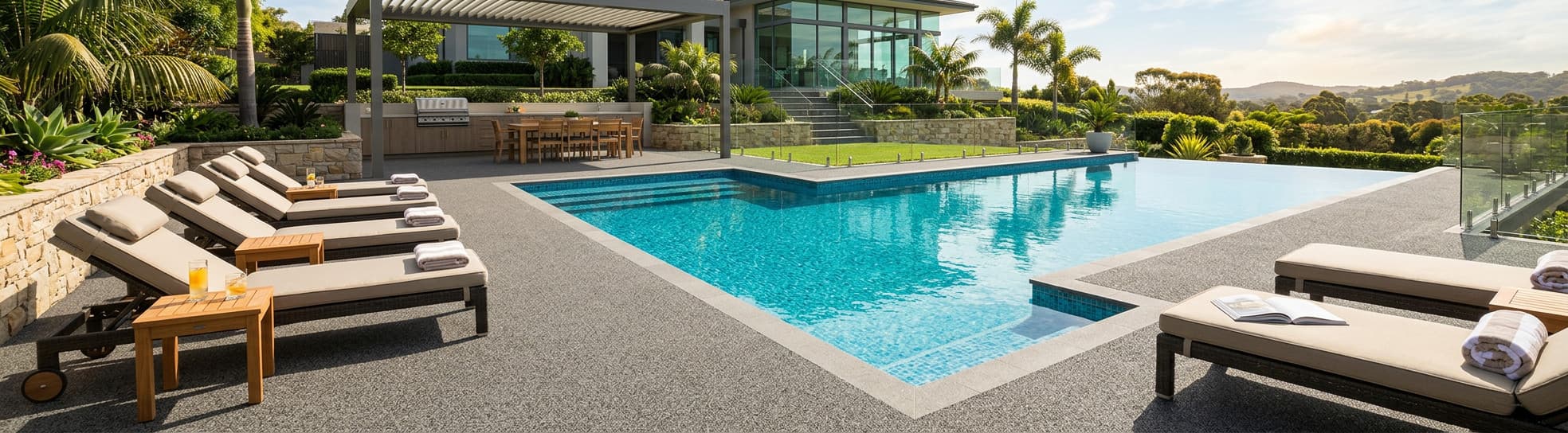 Luxury home backyard pool with Softroc rubber surfacing pool deck